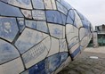 Image of The Big Fish showing images and text on the blue and white scales