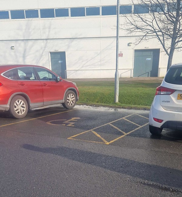 Disabled parking bays out front of venue.