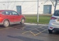 Disabled parking bays out front of venue.