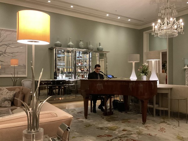 Image of a person playing a piano
