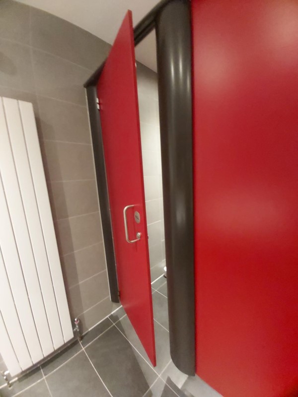 Image of the cubicle door to the accessible toilet.