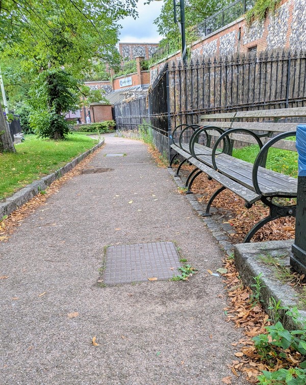 Image of pathway into park that is on an incline
