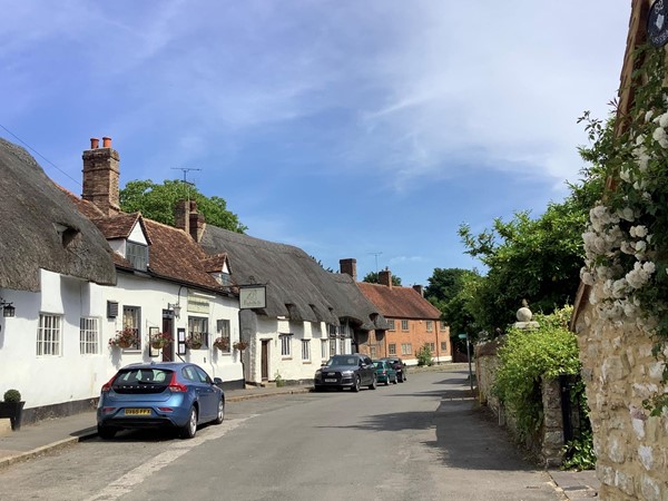 Picture of a street with The Eight Bells pub on it