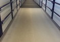 Indoor ramp overhead passage between platforms.