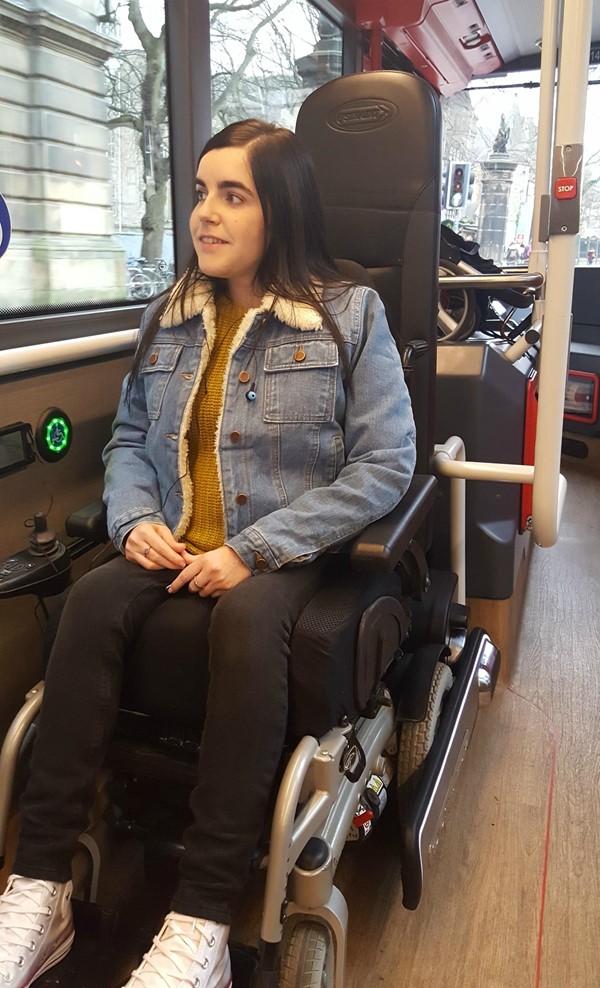 Wheelchair secured with Quantums electronic rubber arms.