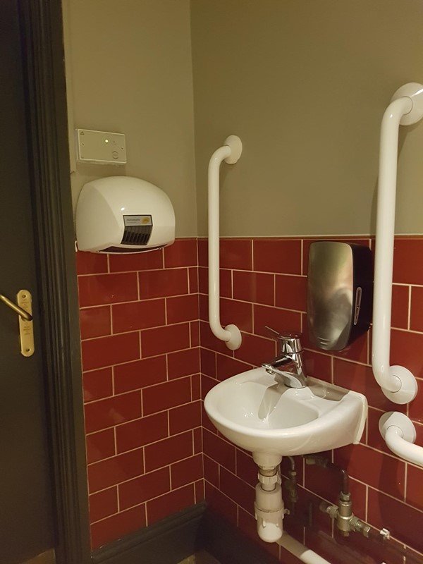 Decent sized, clean with lots of handrails and alarm cords