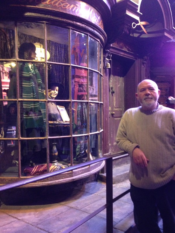 My husband leaning against handrail in Diagon Alley