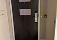 Image of a hotel room door from the interior