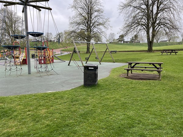 Picnic benches next to the playground