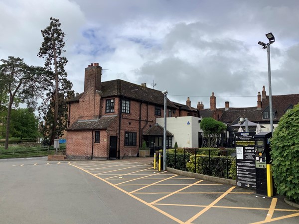 There is a ticket machine as you head towards the Inns entrance