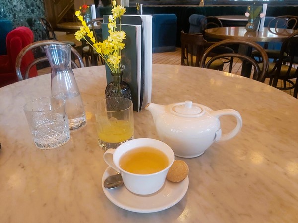 Imafe of a cup of tea and a teapot