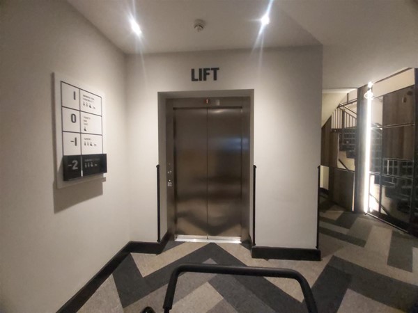 Image of a lift with with a sign on the wall