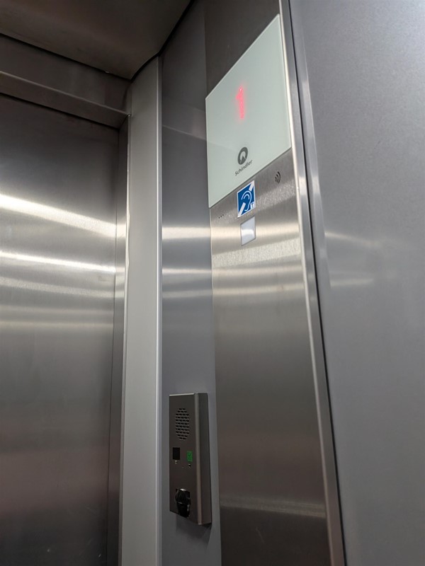 image of hearing loop and floor display inside lift