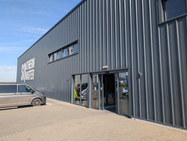 Disabled parking by entrance and auto door with pressure pad