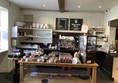 To your left you will find a lovely “Coffee Shop” where you can order, or sit and wait for service. However, you have to get down some steps to reach the seating areas, but these are comfortable enough, in pleasant surroundings