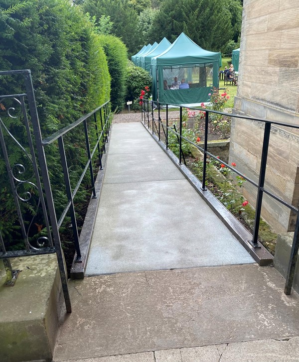 Ramp at left hand side of house.