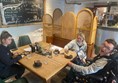 Image of three people in a cafe