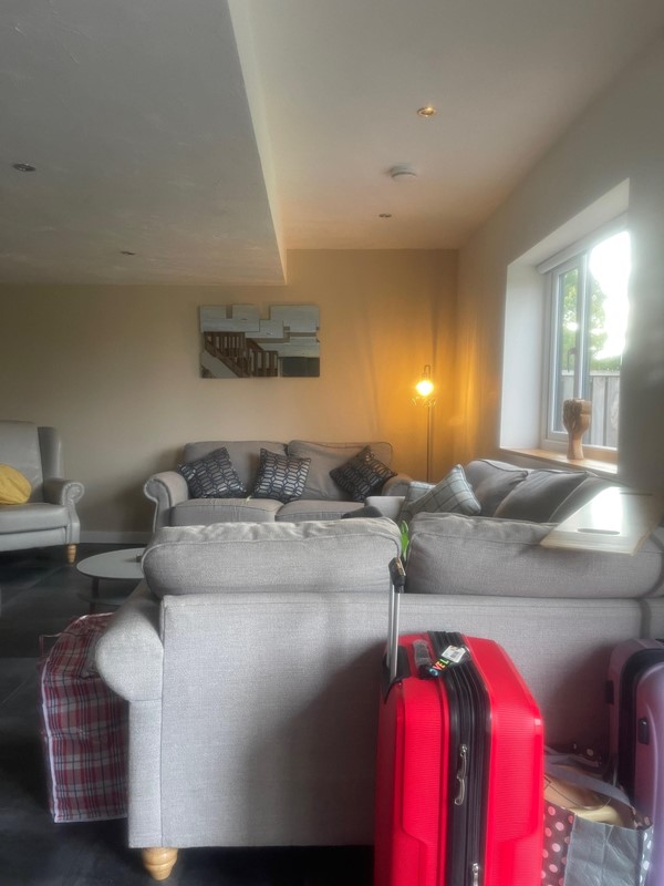 Spacious living room area which is easy to move around in a wheelchair and a nice place for the whole family to sit after a busy day out and about