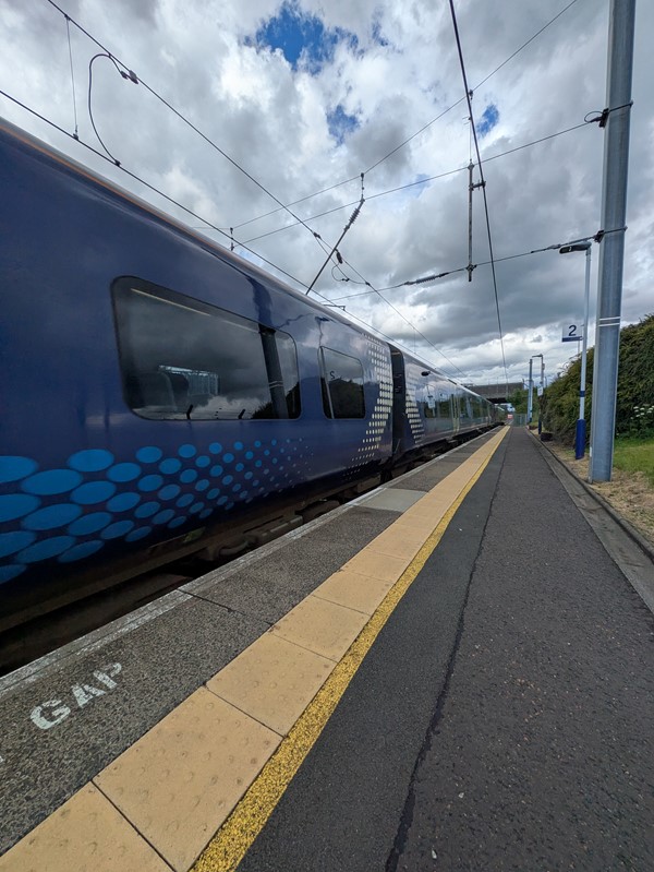 Image of blue train at the platform