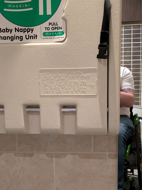 Image of a folded up changing table