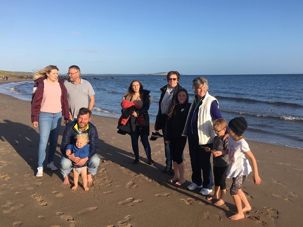 Young and old on the beach.