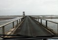 Causeway at low tide that allows vehicles to drive to Holy Island.