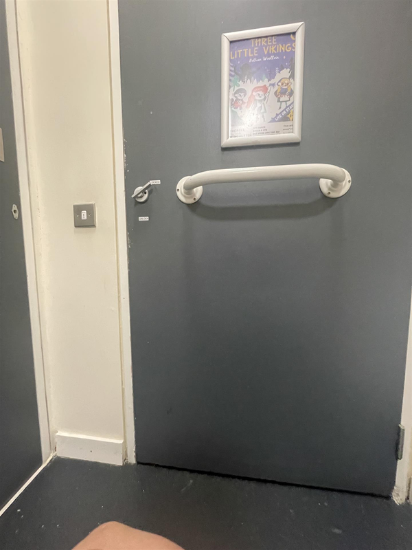 Image of the inside of a toilet door