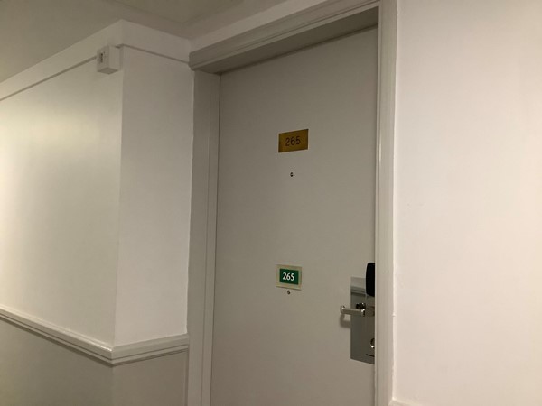 Picture of the door of room 265