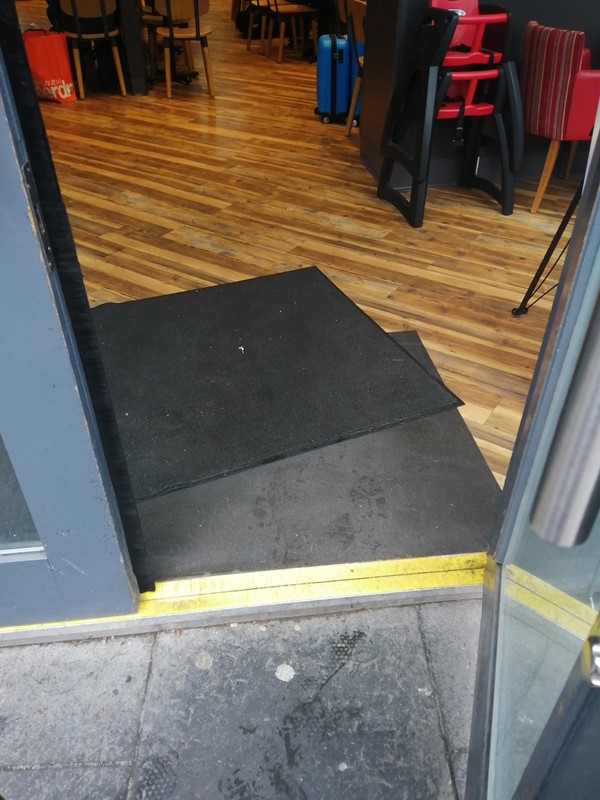 Slight step/raise of floor at street entrance