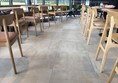 Image of one of the seating areas showing space between tables.