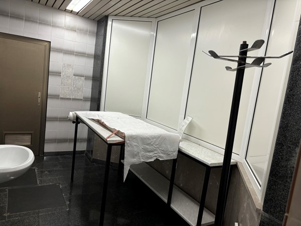 Image of a bathroom with a table and sink