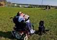 Image of Claire and Sheldon at the dog park.
