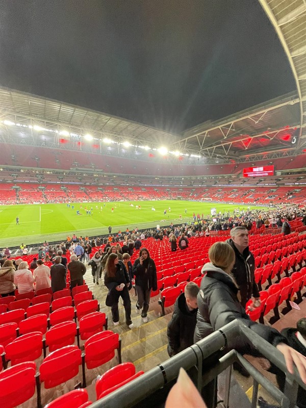 Wembley from the wheelchair & companion seats showing the shallow stairs down to the pitch.