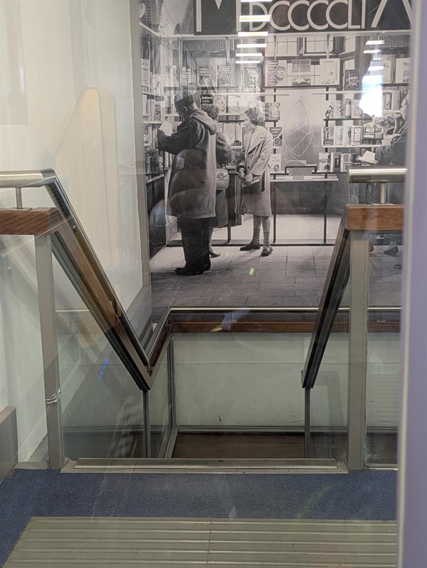 Image of stairs with tactile markings and handrails