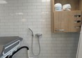 Image of Adjustable change bed and showerr