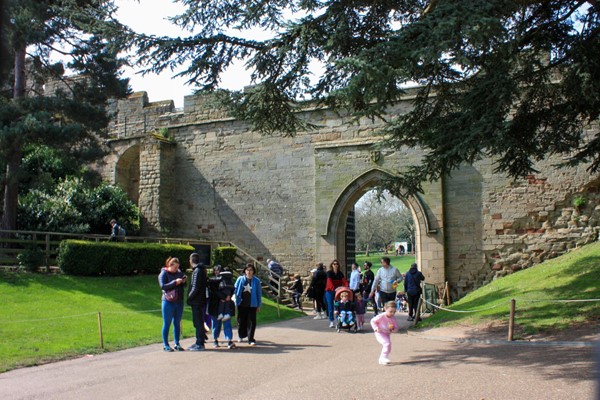 Path with slight hill going through the castle walls