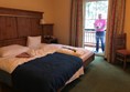 My bedroom with balcony (and dad on his phone lol)!