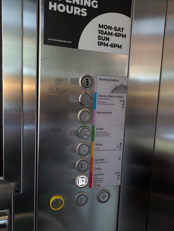 Image of lift buttons with Braille markings