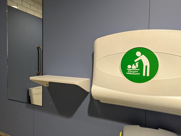 Image of Colostomy shelf and baby change table in the accessible toilet