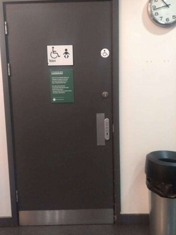 the accessible toilet, with a sign explaining all other toilet locations