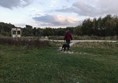 Large grass viewing area over pond (behind me) with little path back up to main track.