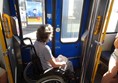 The wheelchair space on one of the older trams. The button to alert the driver that you wish to get off is on the blue door, and one of the pink pads on which you touch your chipkaart is just behind the wheelchair.