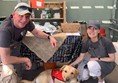 Picture of two people with an assistance dog at Darts Farm