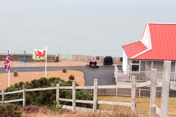 View from the top of the hill showing wheelchair user on good paths