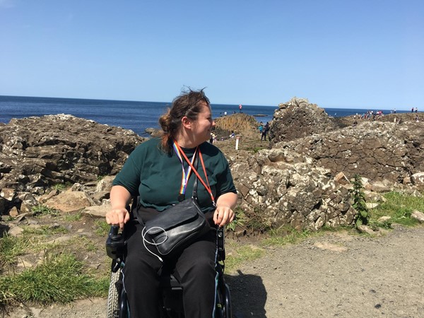 Image of myself in my powerchair facing the camera but looking over at the causeway.