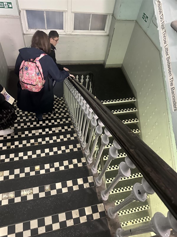Image of people on staird