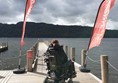 View of powerchair user on Jetty overlooking the lake