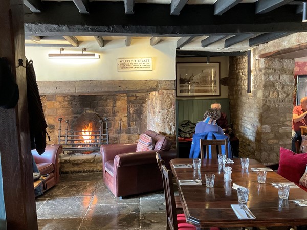and with a warm glow in the open fireplace, and polished flagstones, the 400 year old Inn of mellow Cotswold stone has  a pleasant bar to enjoy lunch