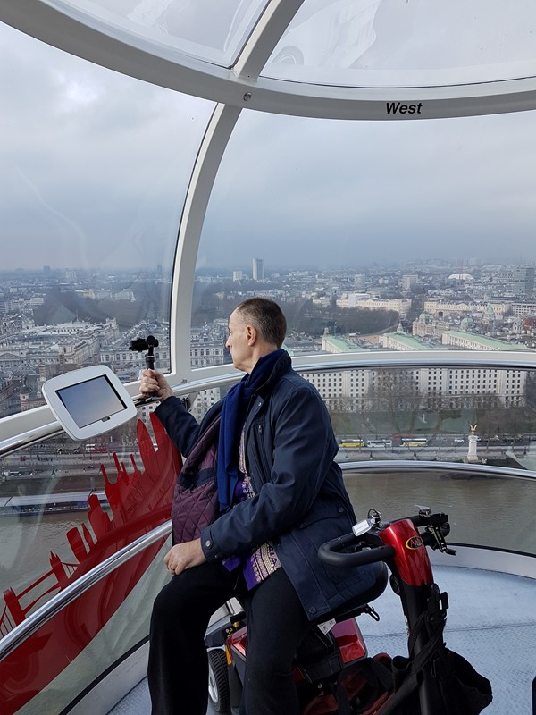 Mobility Scooter User in London Eye Pod