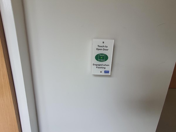 Image of the button to open the Changing Places toilet.